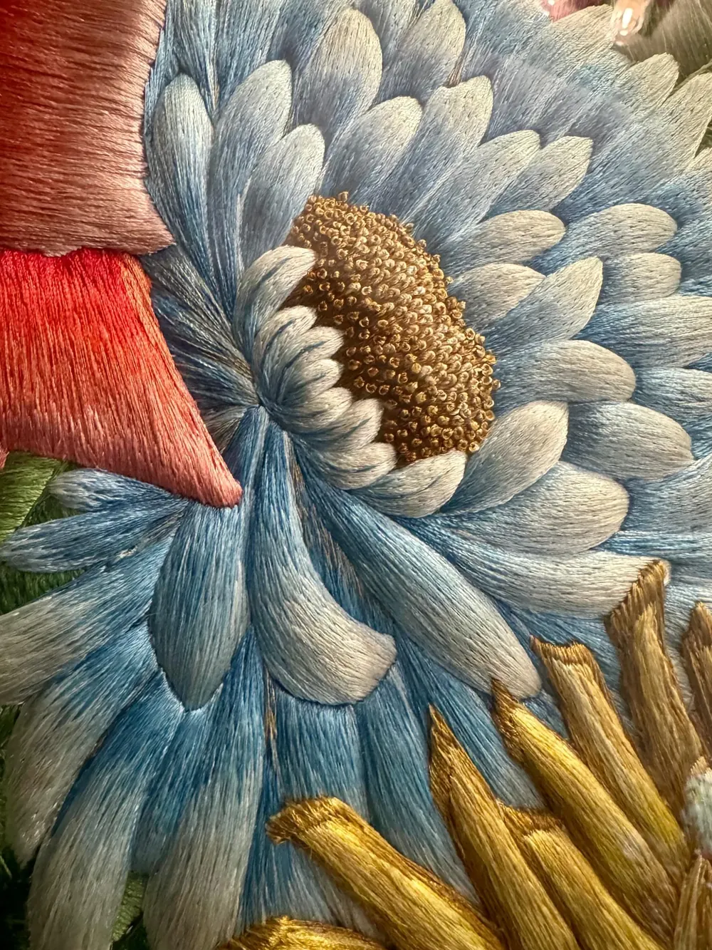 A blue chrysanthemum in raised silk